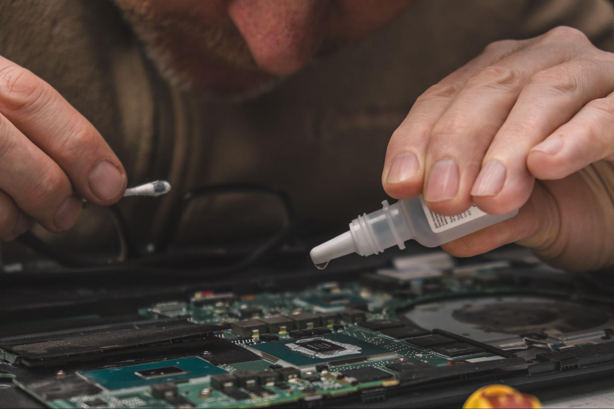 Close-up of professional maintenance for HP computer screen repair and laptop battery replacement in Singapore.